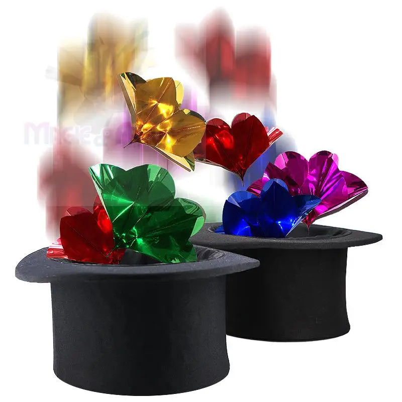 Zwei schwarze Zylinder mit bunten, metallischen, herzförmigen Verzierungen.