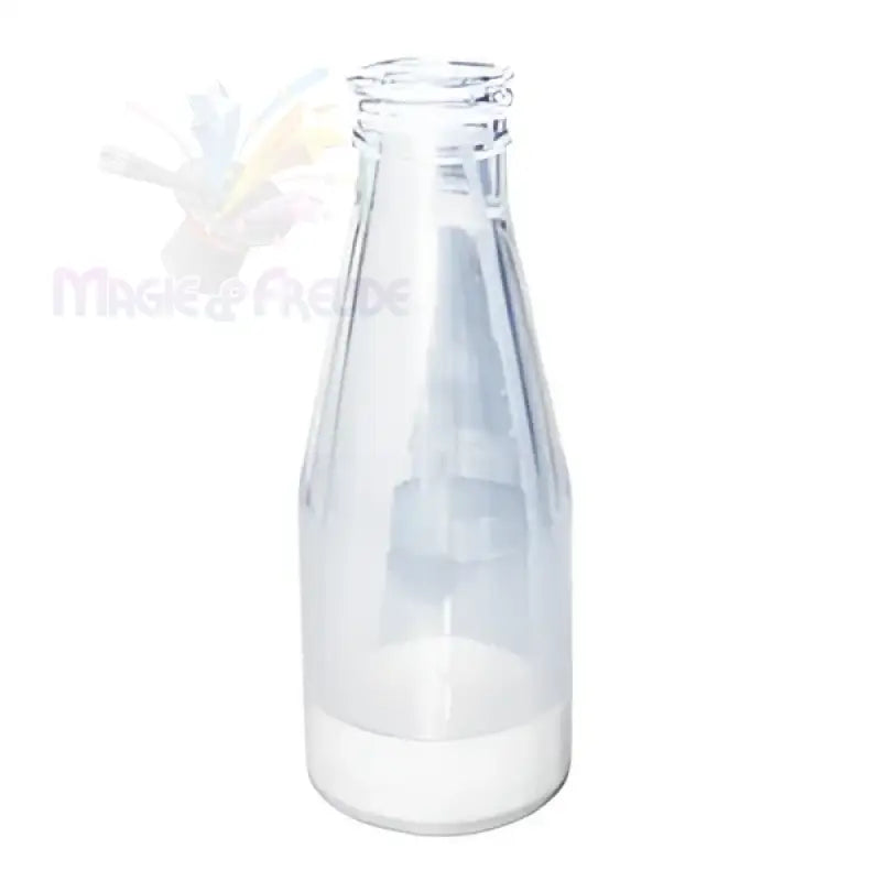 Eine leere Milchflasche aus Klarglas mit einer kleinen Menge weißer Flüssigkeit am Boden.