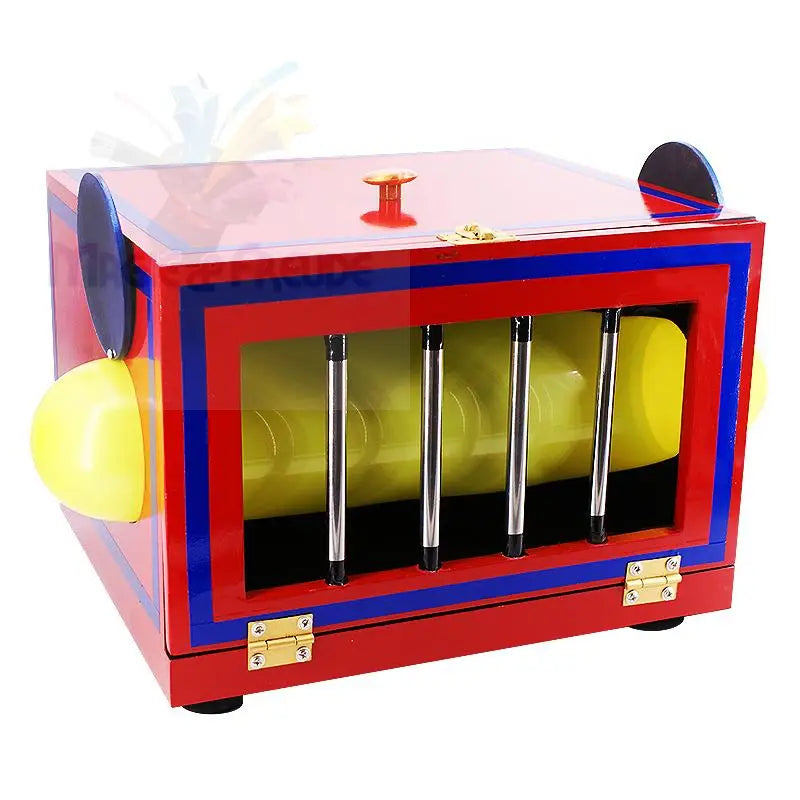 Eine rote und blaue Zauberkiste mit gelben Halbkugeln an den Seiten und einem durchsichtigen Deckel.