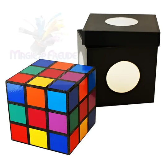 Ein buntes Rubik’s Cube-Puzzle neben einer schwarzen Schachtel mit weißen, kreisförmigen Ausschnitten.