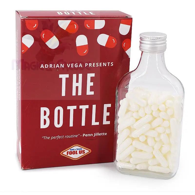 Ein Zaubertrickset mit einer roten Schachtel mit Kapselmotiven und einer klaren Glasflasche, die mit weißen Kapseln gefüllt ist.