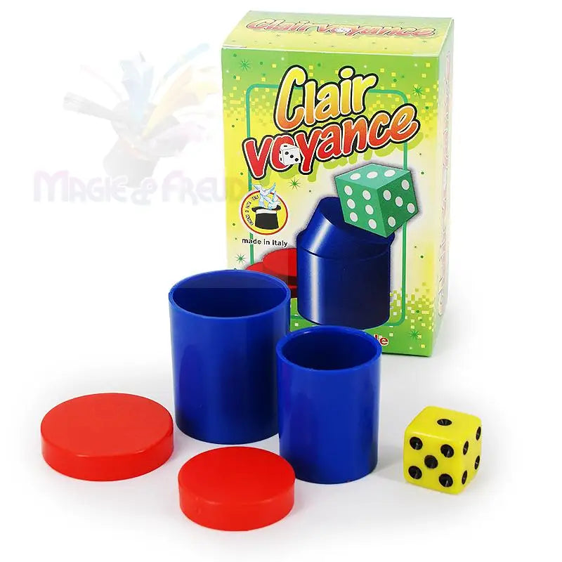 Ein Zaubertrickset mit zwei blauen Bechern, zwei roten Scheiben, einem gelben Würfel und einer Schachtel mit der Aufschrift ’Clair Voyance’.