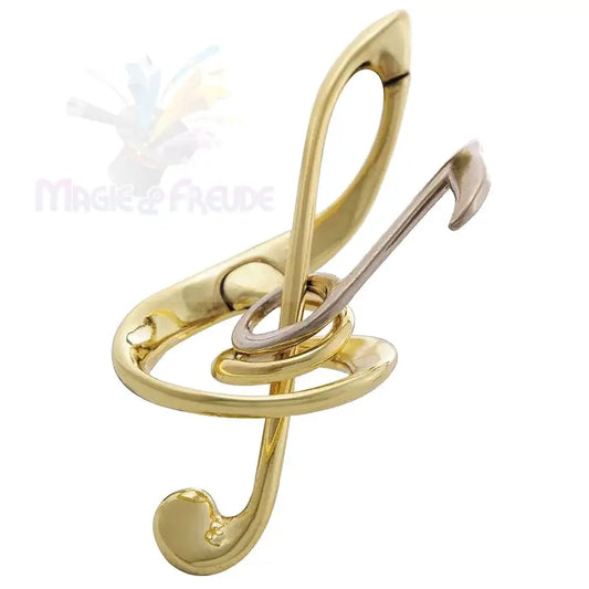 Ein zweifarbiges Metallpuzzle in Form eines Violinschlüssels oder ein dekoratives Objekt.