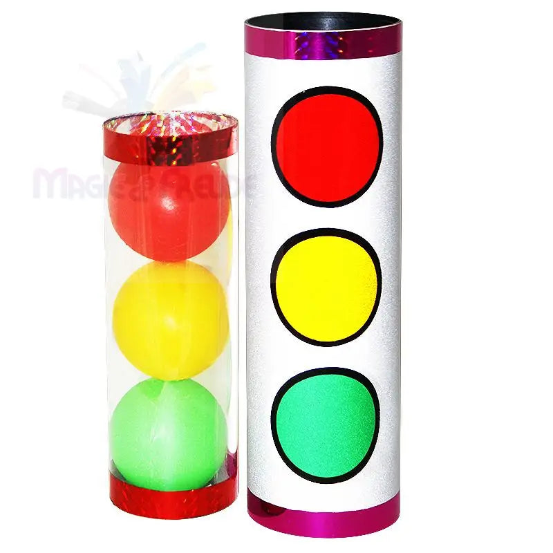 Ein Zaubertrickset mit einer durchsichtigen Röhre mit drei farbigen Kugeln (rot, gelb, grün) und einem passenden Zylinder mit Ampelmotiv.