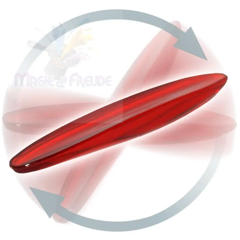 Ein rotierendes, längliches rotes Objekt mit einer glänzenden Oberfläche.