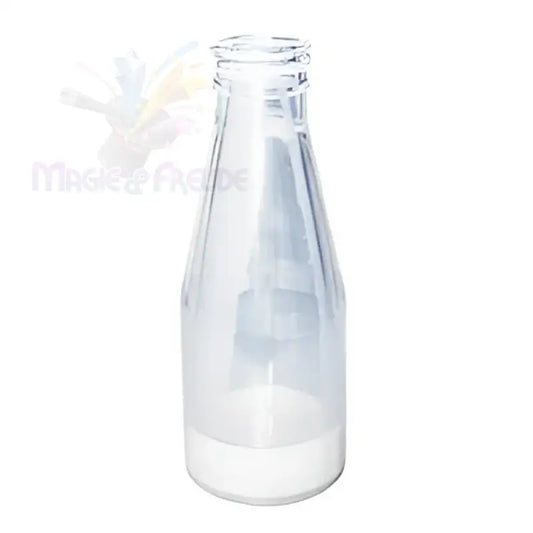 Eine leere Milchflasche aus Klarglas mit einer kleinen Menge weißer Flüssigkeit am Boden.