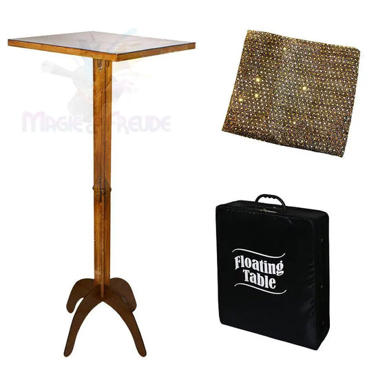 Ein zusammenklappbarer Holztisch mit einer schwarzen Tragetasche und einem glitzernden Goldtuch.