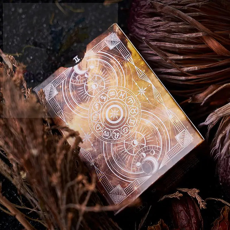 Eine rechteckige Lidschattenpalette mit einem himmlischen und astrologischen Design.