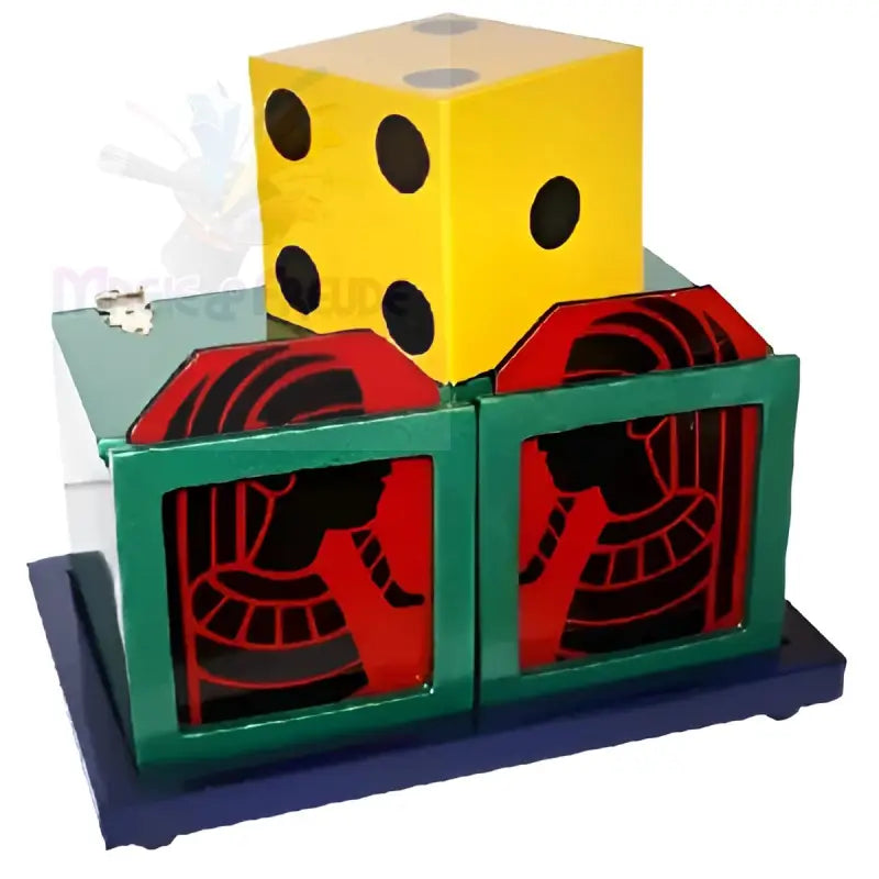 Zaubertrickapparat mit einem gelben Würfel und zwei dekorativen grünen und roten Schachteln.