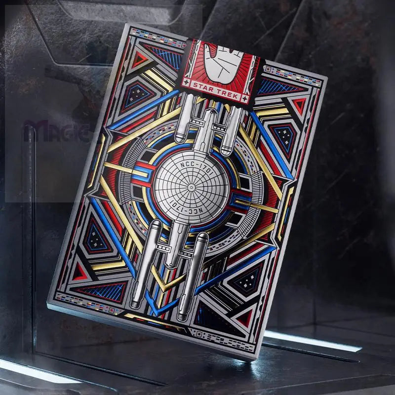 Silberne Star Trek Sammlermünze mit bunten geometrischen Mustern und der USS Enterprise.