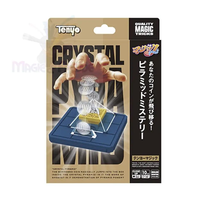 Ein Zaubertrickset mit einer Kristallpyramide und Münzen.