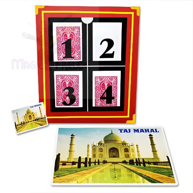 Ein rot-schwarzes Zaubertrick-Requisit mit nummerierten Karten und zwei Taj Mahal Bildkarten.